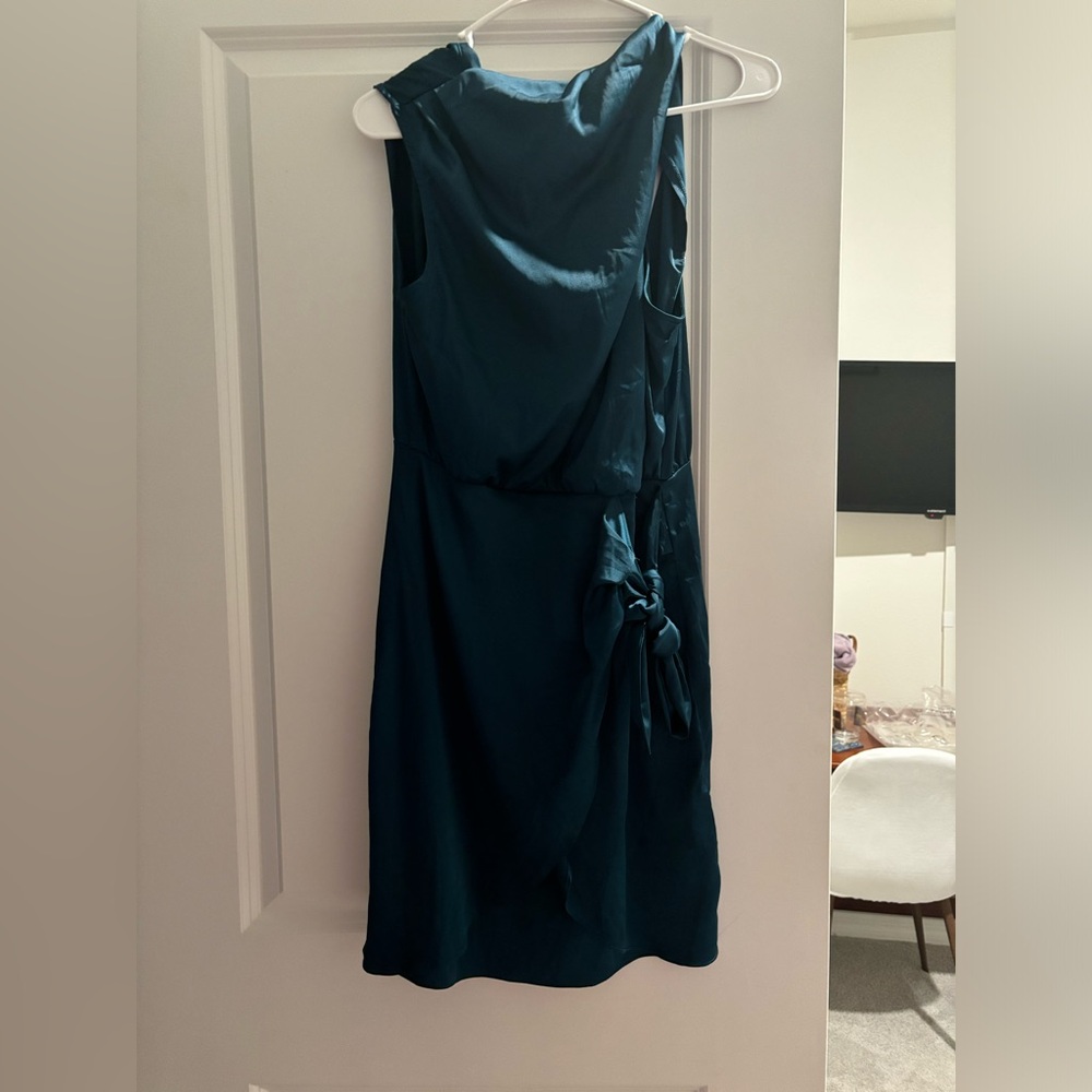 Emerald green mini dress with a high neck. Satin/silk material. Worn ONCE.